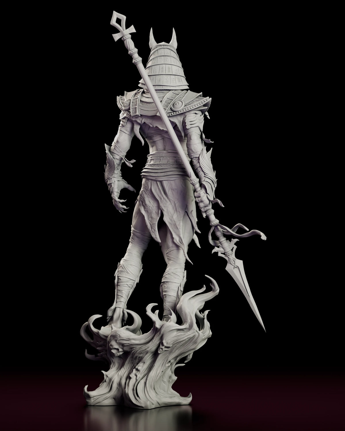 Back view of the Anubis figure model kit showing the ankh staff across his back and the swirling base