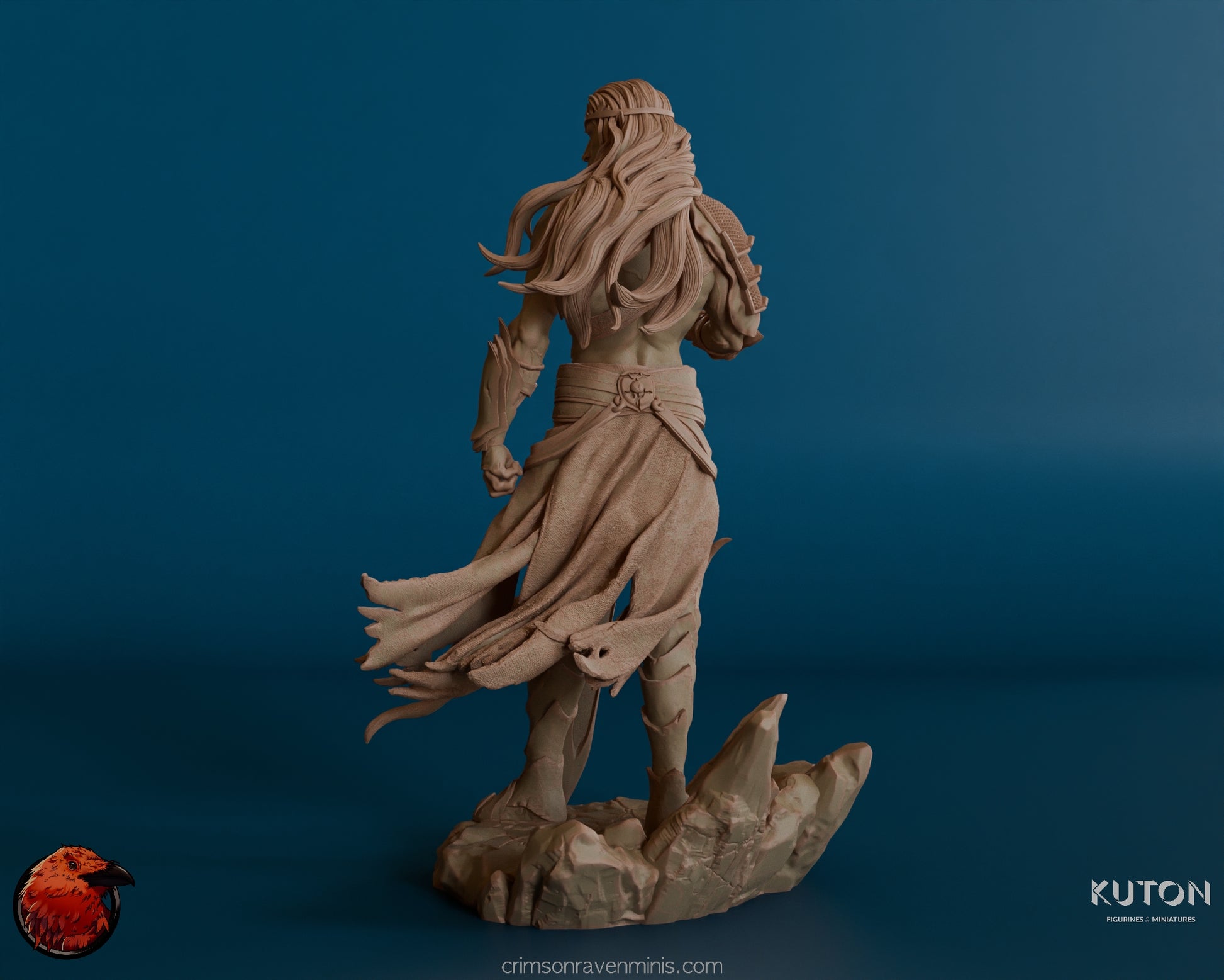 A rear view of the Elf warrior figure, highlighting the long, flowing hair and billowing cloak that cascades down the back. The rugged rock base is also visible from this angle, with intricate details in the armor and cloth.