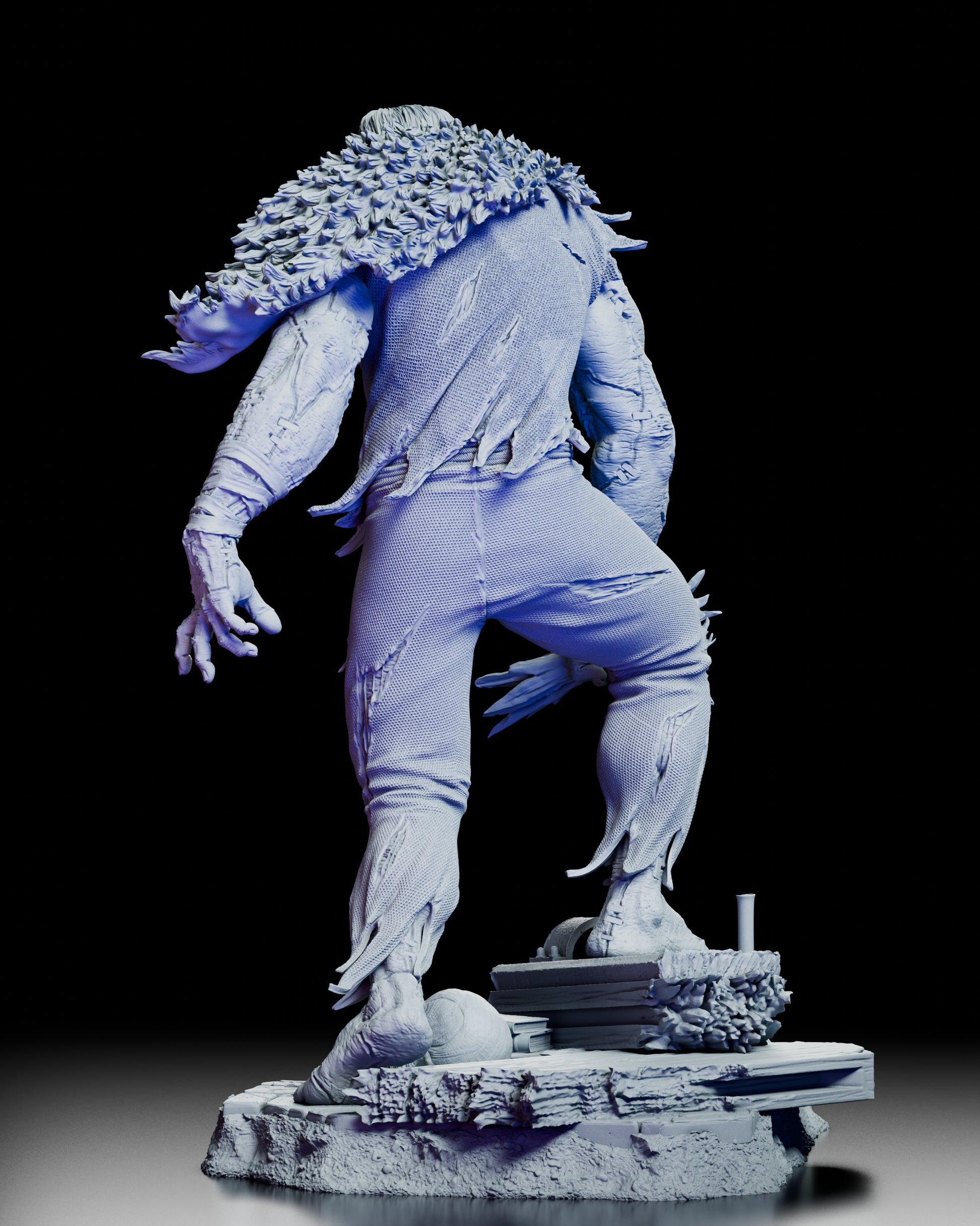 Rear view of Frankenstein’s Monster figure kit showing sculpted back muscles, shredded clothing, and detailed base.
