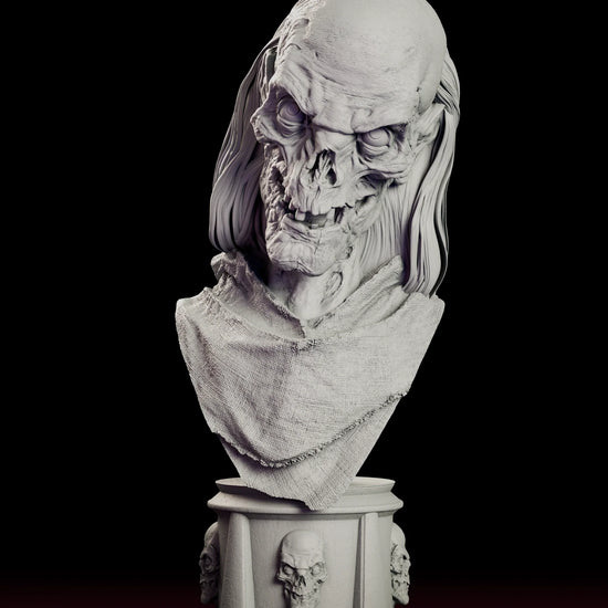 Rotating 360 degree view of the Crypt Keeper bust figure model kit, showing the wrinkled bare cranium, sunken eyes, wide toothy grin and long lank hair above a draped shroud on a column plinth ringed with skulls
