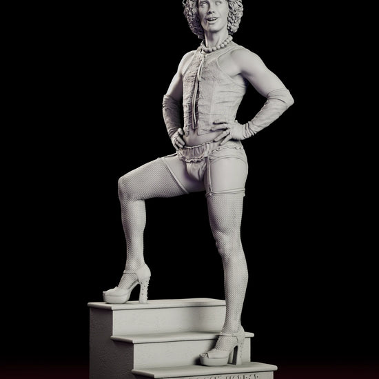 Rotating view of the Dr. Frank-N-Furter figure model kit posed with one heel up on a staircase base carved with the film logo