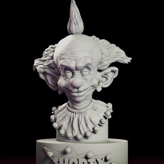 Full 360 degree turntable of the Shorty bust figure model kit, showing the pointed topknot, huge ears and pompom-trimmed collar above a lettered plinth