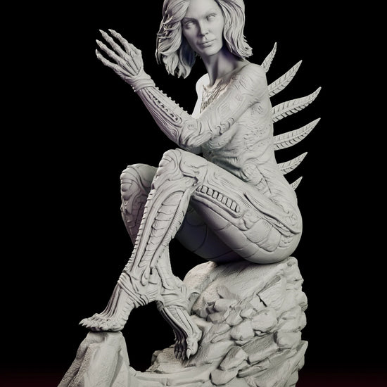 Rotating view of the Sil figure model kit, a crouching alien hybrid with a human face and biomechanical body on a rock base