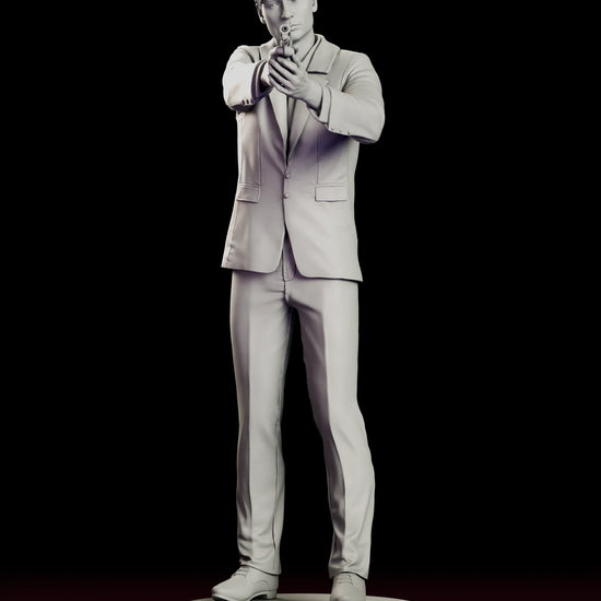 Rotating view of the Fox Mulder figure model kit in a suit and tie aiming a pistol with both hands on a round base