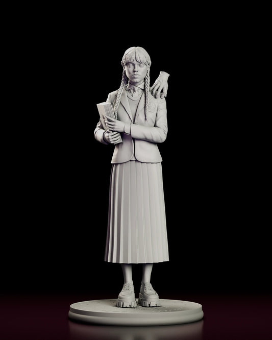 Rotating 360 degree view of the Wednesday Addams figure model kit, showing the braided student in a crested Nevermore blazer and pleated skirt holding an engraved book, with Thing perched on her left shoulder and the academy emblem on the round base