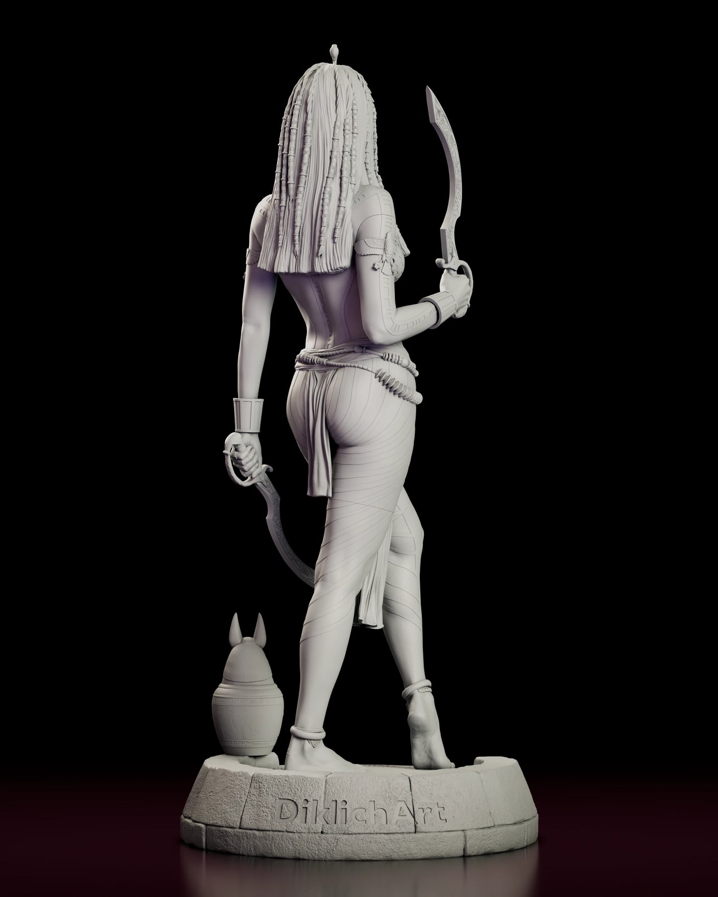 Rear view of the Anck-Su-Namun figure model kit showing the beaded braids down her back, the belted waist and the sculptor's name cut into the base rim