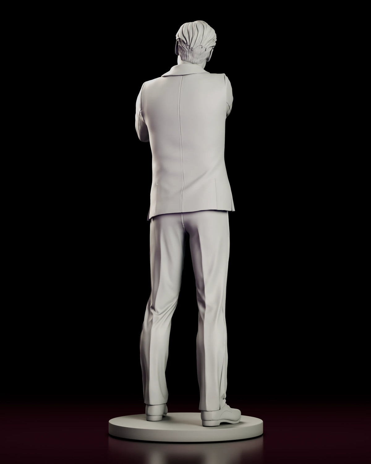 Rear view of the Fox Mulder figure model kit showing the back seam of the suit jacket and laced shoes on the round base