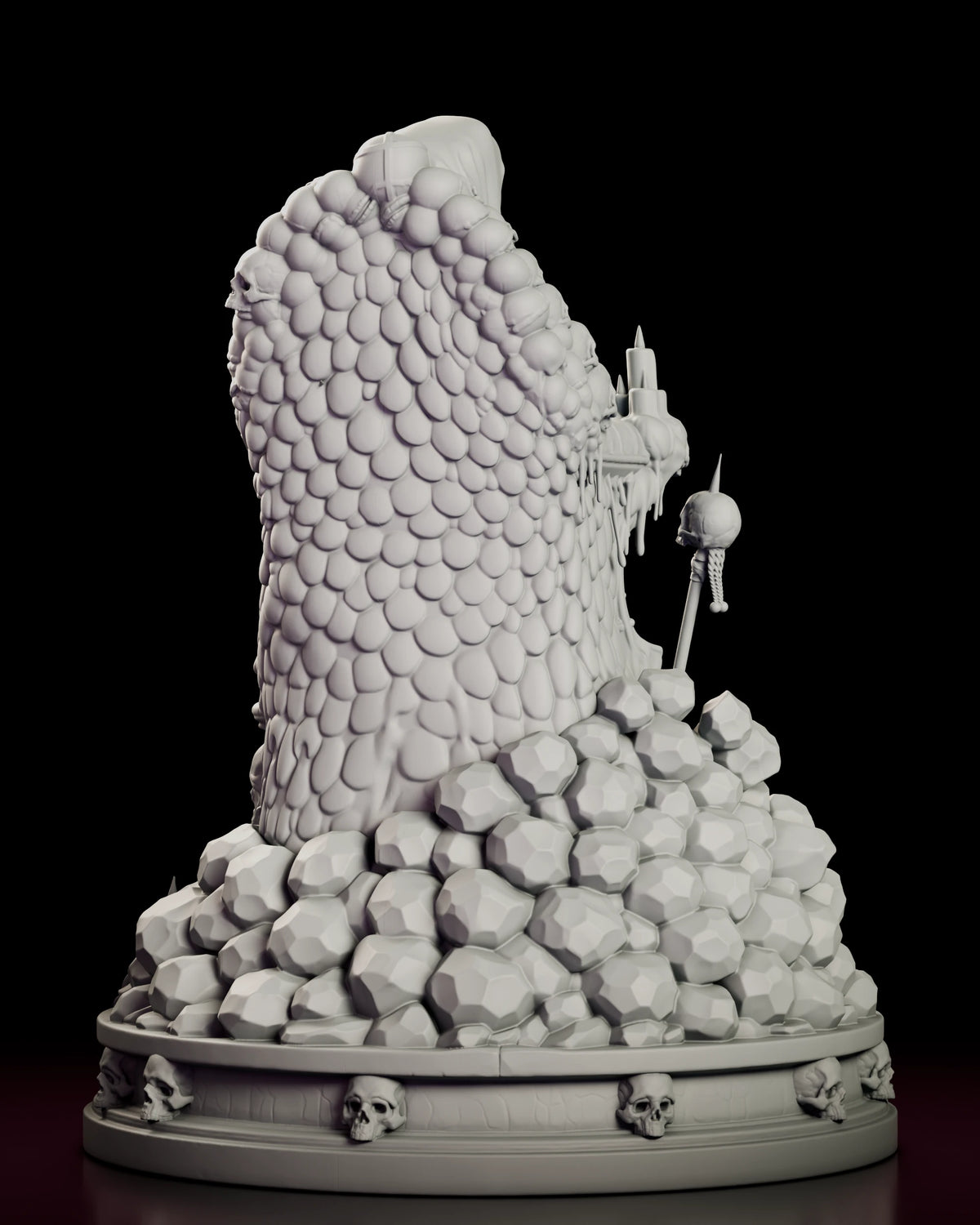 Back view of the Crimson King figure model kit showing the scalloped throne back, piled boulders and the skull-ringed base
