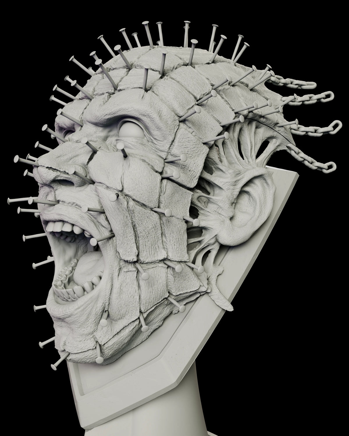 Side profile of the Pinhead full scale bust with mouth wide open in a scream and exposed tissue behind the ear