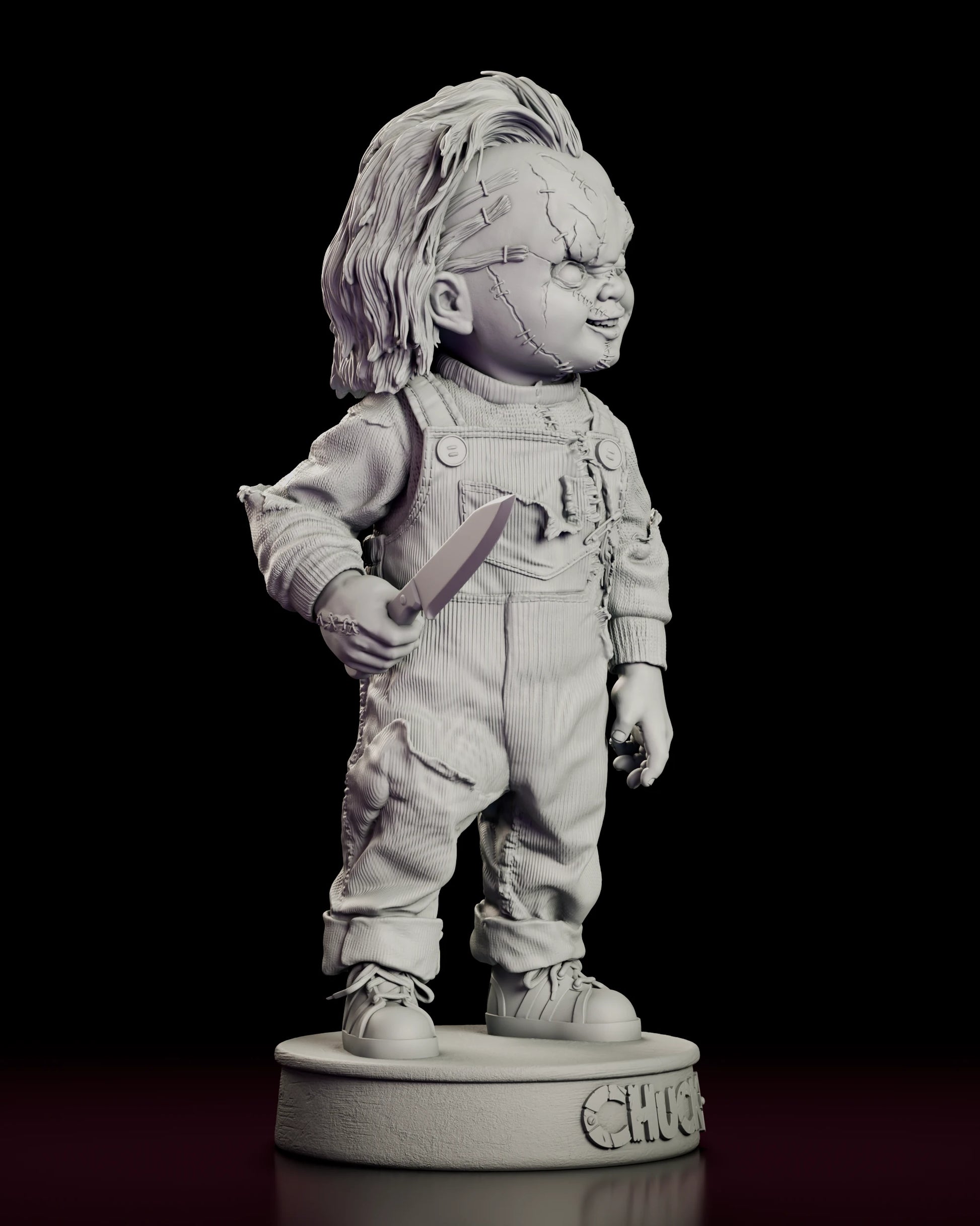 Right side view of the Chucky resin model showing the frayed overall strap and rolled sweater cuff