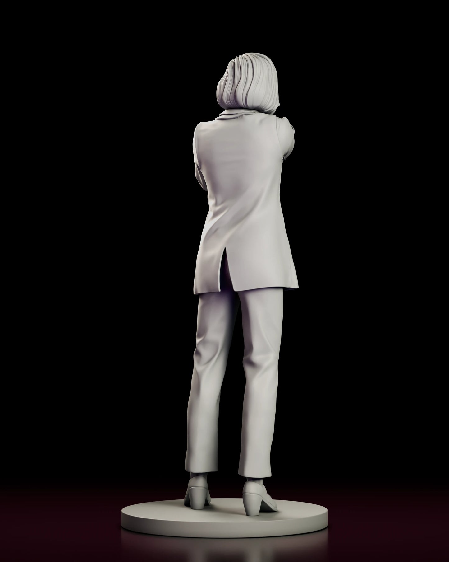 Rear view of the Dana Scully figure model kit showing the vented hem of the blazer and the bob turned toward the shoulder