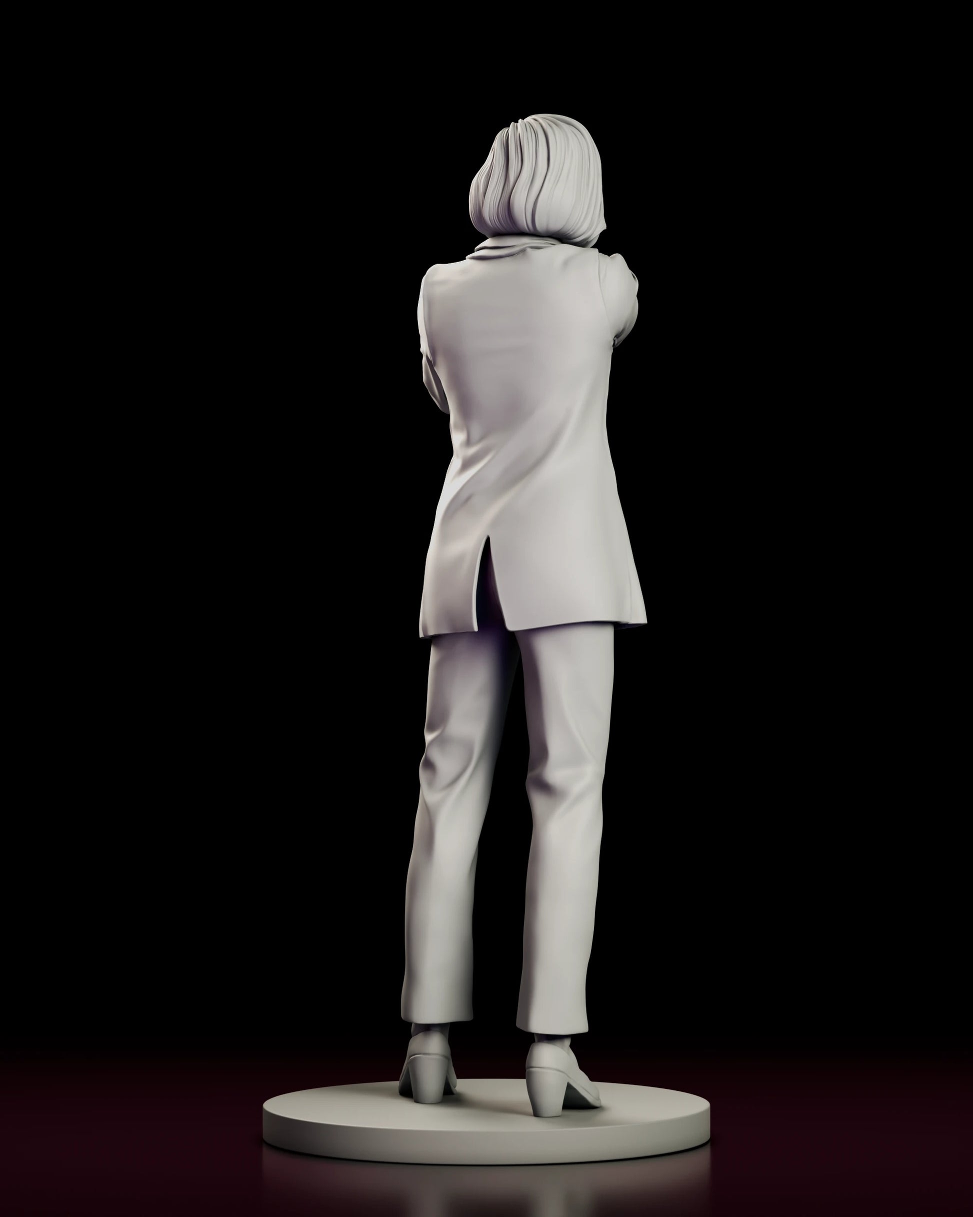 Rear view of the Dana Scully figure model kit showing the vented hem of the blazer and the bob turned toward the shoulder