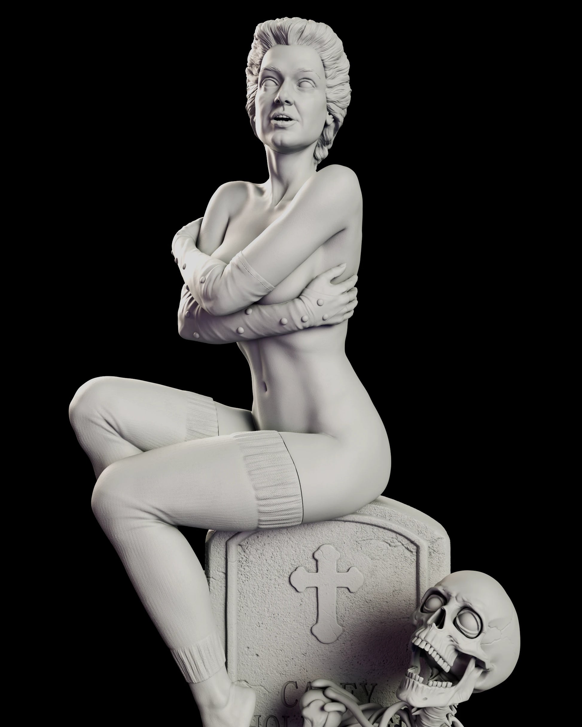 Close view of the Trash figure model kit showing the folded arms, studded arm warmers, ribbed leg warmers and the carved cross on the headstone