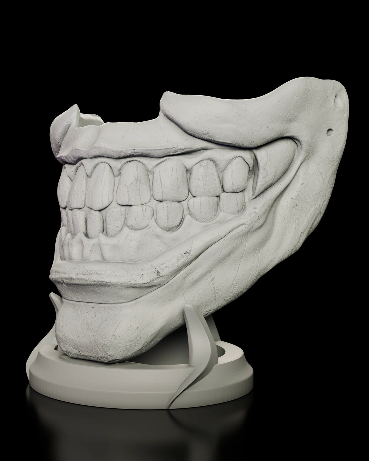 Angled view of the Twisty mask showing the full rows of sculpted teeth and the weathered surface