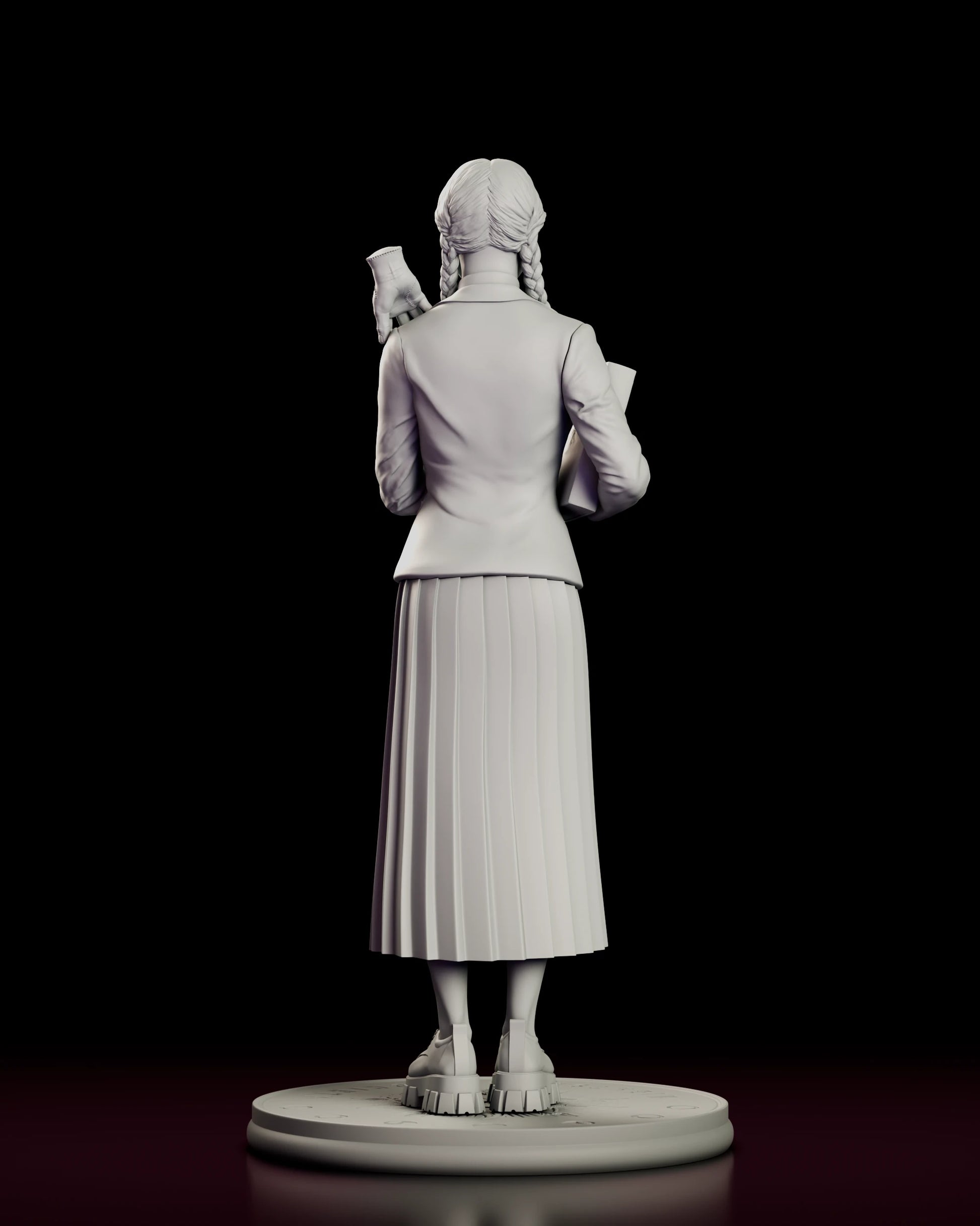 Rear view of the Wednesday Addams figure model kit showing the back of the Nevermore blazer, the braids falling behind her shoulders and the pleating of the skirt