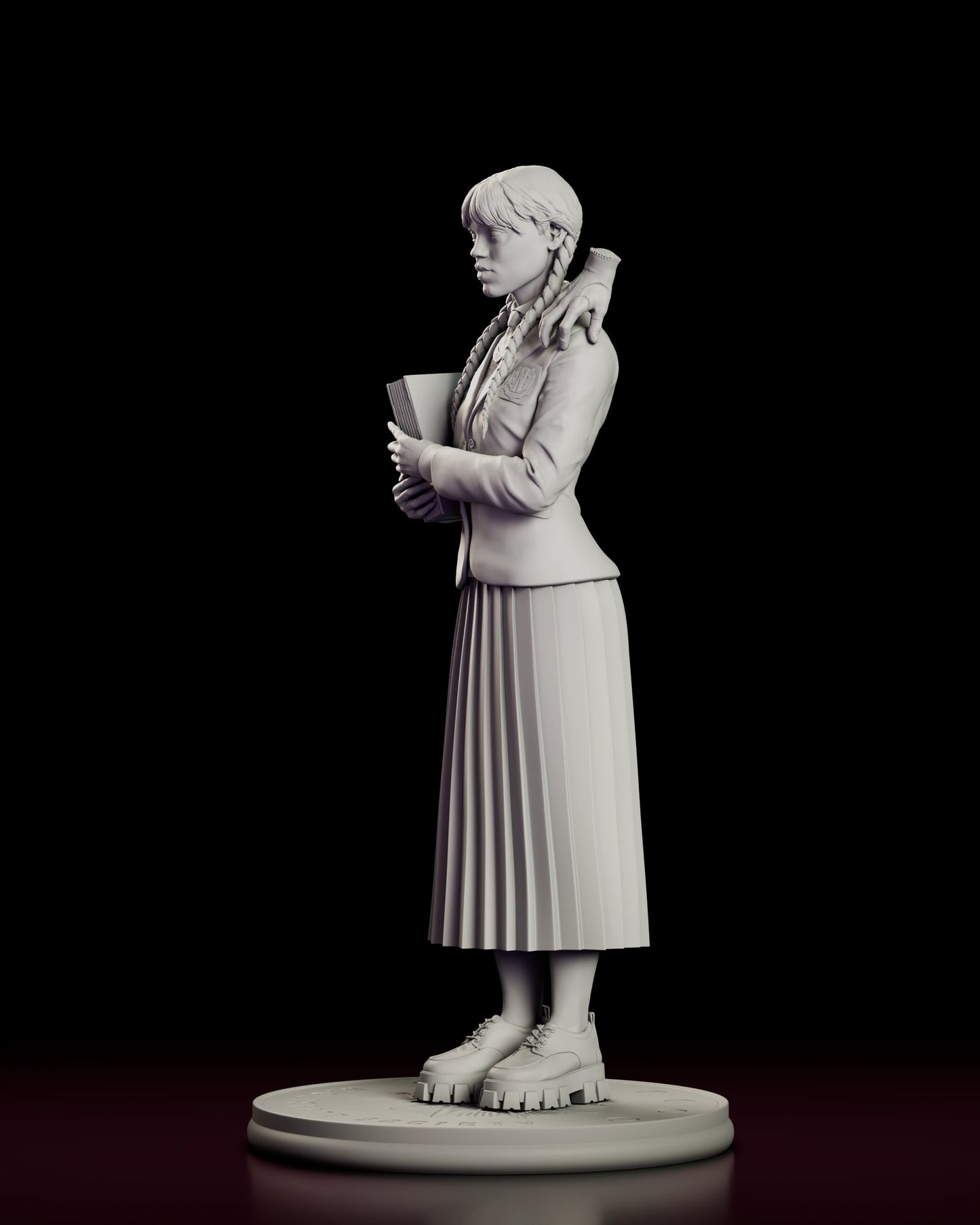 Left side view of the Wednesday Addams figure model kit in profile, with Thing resting on her shoulder, the book held to her chest and the braid falling forward over the blazer