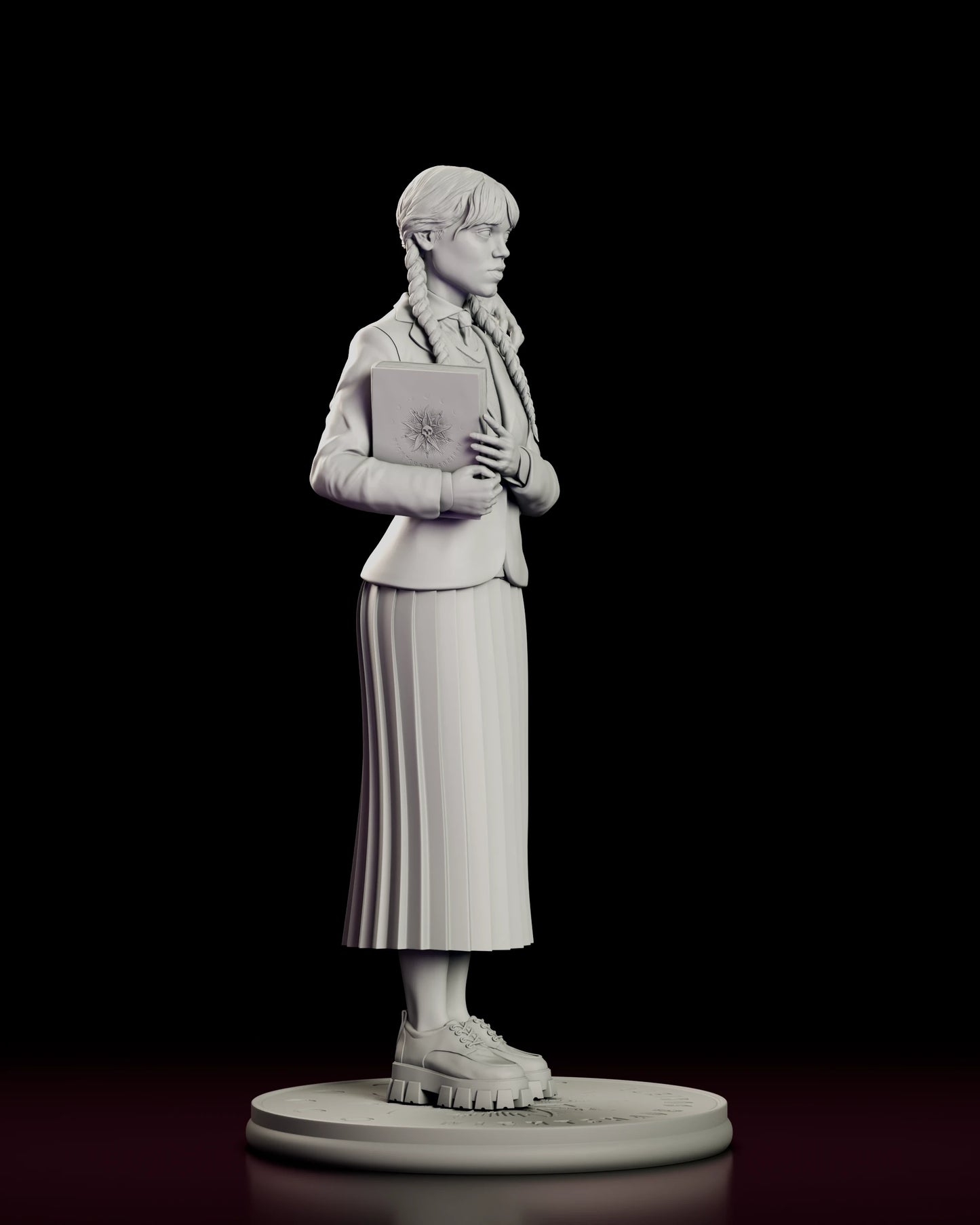 Right side view of the Wednesday Addams figure model kit showing the engraved sunburst and skull on the book cover, the cut of the blazer and the fall of the pleated skirt over lug-soled shoes